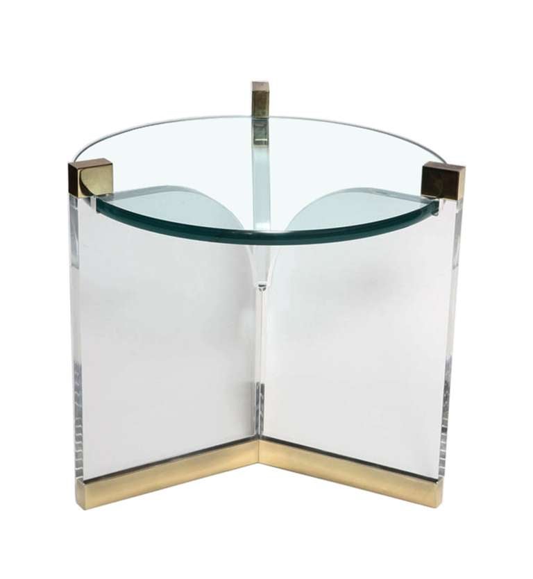 Stunning pair of occasional tables in Lucite and brass designed and manufactured my Charles Hollis Jones in the mid-1970s.
The tables are very delicate to the eye and yet very imposing in design appeal, they combination of metal is perfect and the