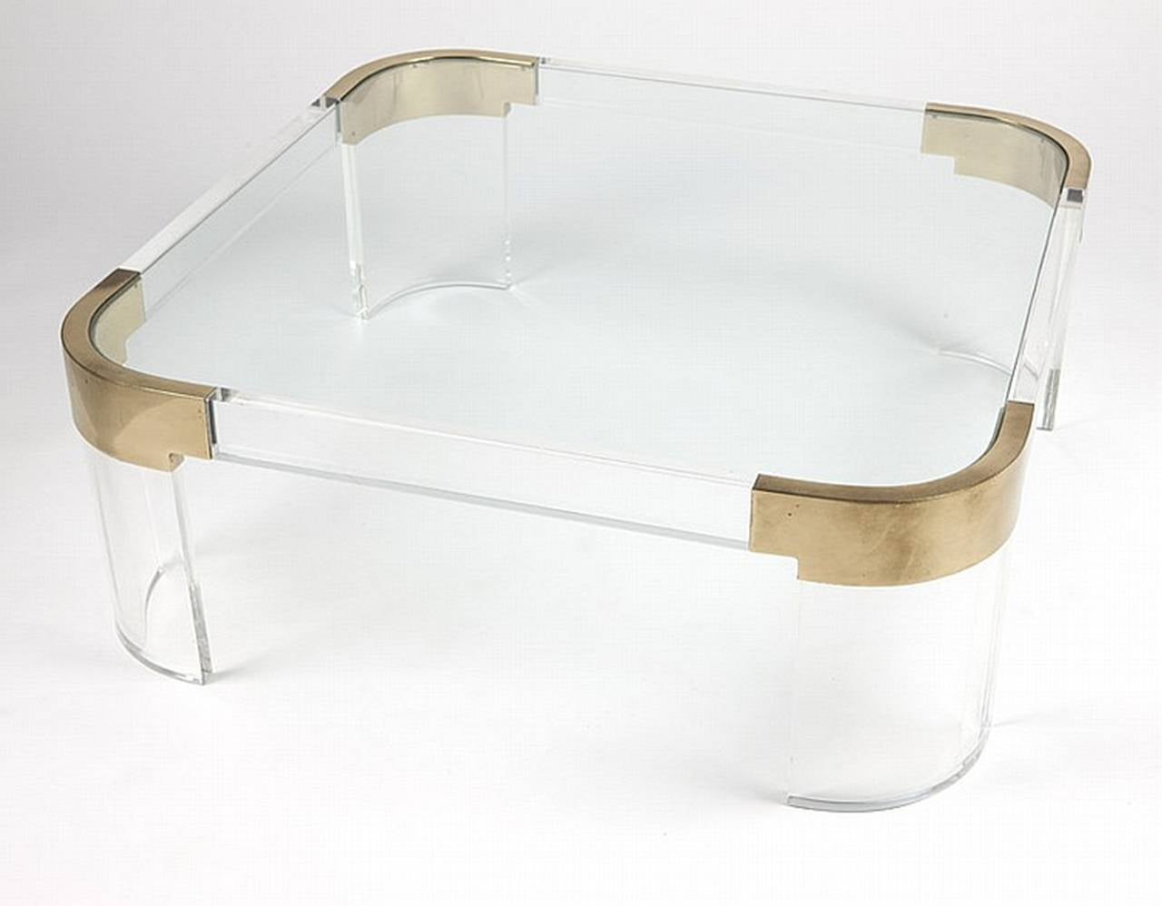 Sleek coffee table executed in Lucite and solid brass designed in the 1970s by the Lucite icon, Charles Hollis Jones. The table is part of Charles Hollis Jones 