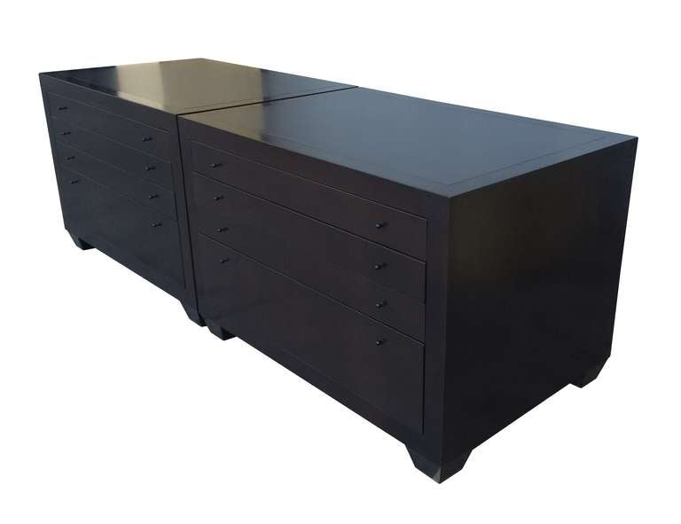 Stunning pair of four drawers dressers finished in a beautiful dark finish and beautiful architectural legs.
The cabinets can be pushed together as shown when used at an office space but they can also be used independently when used as