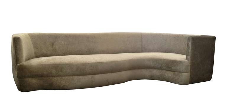 Stunning sofa newly upholstered in brown velvet fabric which is very soft and inviting, the sofa has a beautiful shape one side wraps around making it perfect to just lounge and relax.
The base consists of two round pedestals and a long slat of