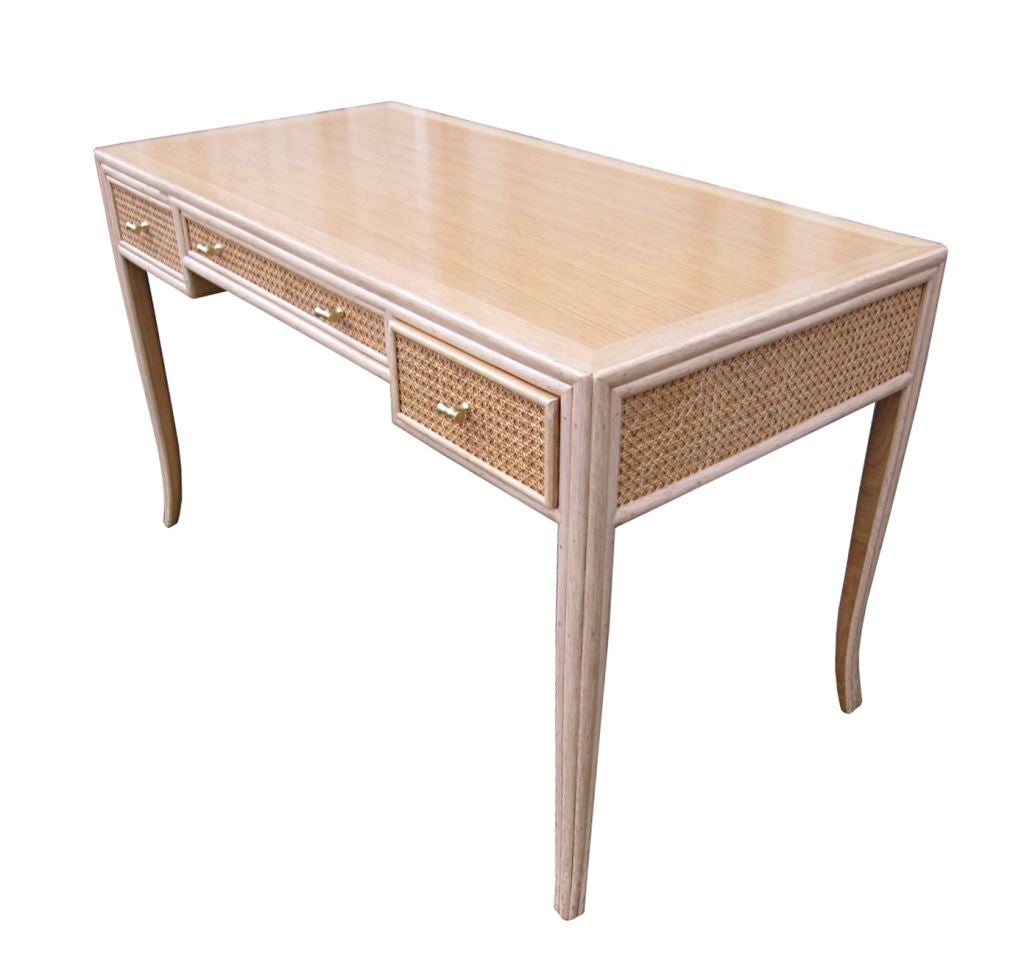 Beautiful desk by McGuire furniture from San Francisco, this desk form meets function in this desk. Here, the top, apron and three drawers are a reversed curve. 
The desk is very versatile and can be used even as a sofa table and is small enough