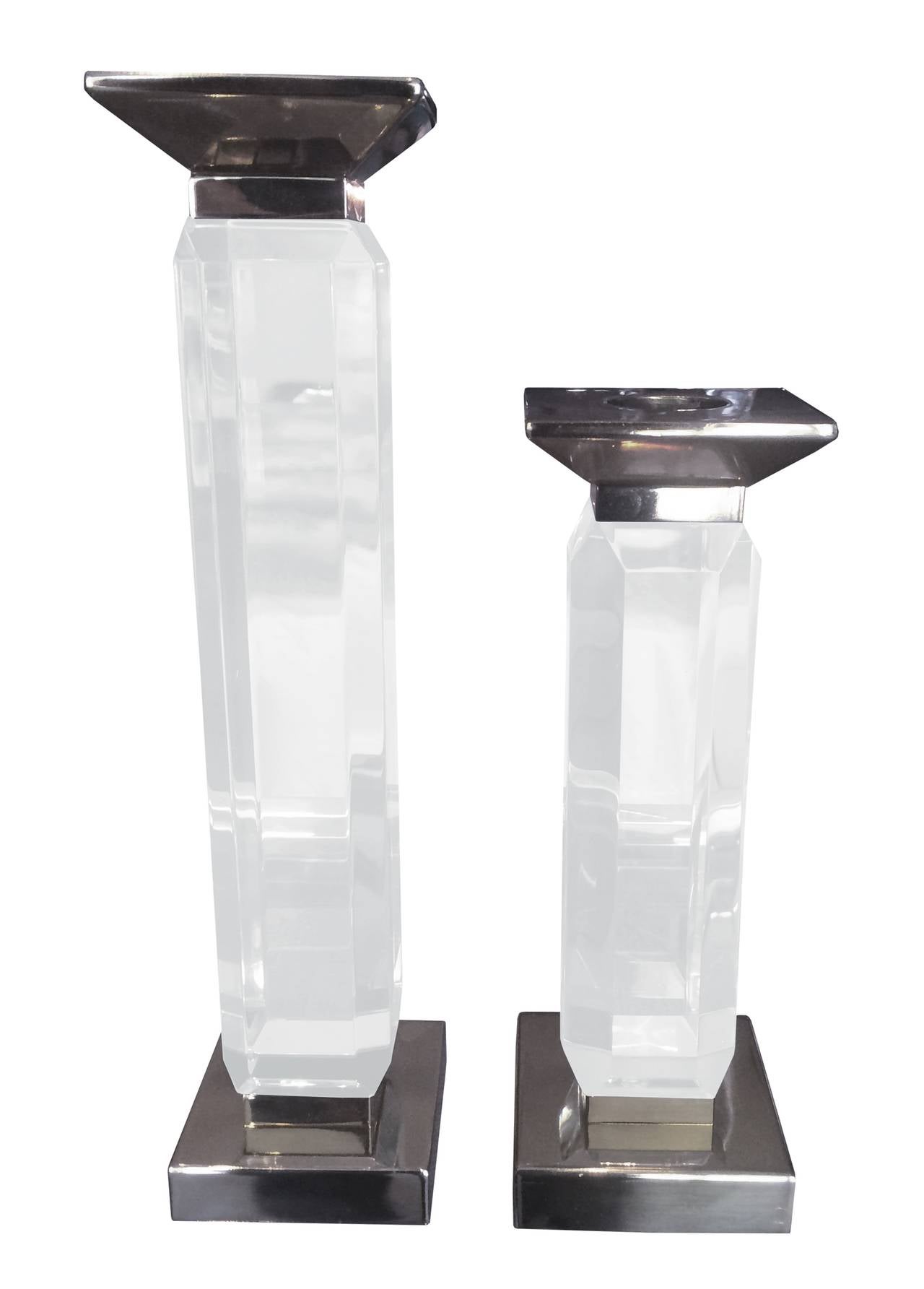 Beautiful pair of Charles Hollis Jones Lucite & Nickel candle holders designed and manufactured in the 1960's.
These candle holders are in excellent original condition, the Lucite has a beautiful bevel finish and the metal is very clean.

We have