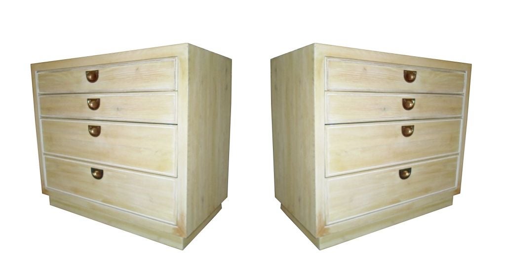 Exceptional pair of Romweber dressers made of solid cerused oak and brass hardware. These fantastic pieces speak style and sophistication and the spacious drawers slide very smoothly while the brass handles have a wonderful aged patina and they