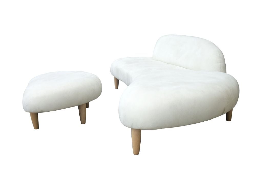 Noguchi’s sculptural idiom gains full expression in this sofa, which clearly distinguishes itself from other designs of the same period. The sofa and ottoman seem almost like a greatly enlarged sculpture of flat, rounded river stones; yet at the