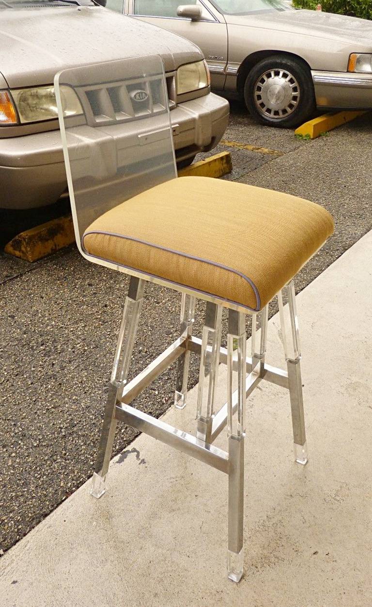 Beautiful bar-stool designed by Charles Hollis Jones in the 1970's, this design is a blend of his Metric collection and the Waterfall line, and as you can see the blend was executed beautifully.
The frame is nickel and Lucite and the seat is Lucite