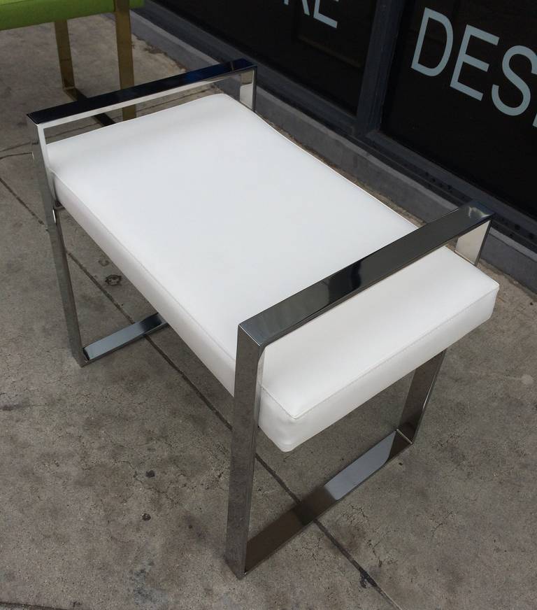 Pair of polished nickel benches designed and manufactured by Charles Hollis Jones in the 1970s.

The frames of the benches are made in solid steel and nickel-plated, they are upholstered in white Naugahyde but they are also available in other