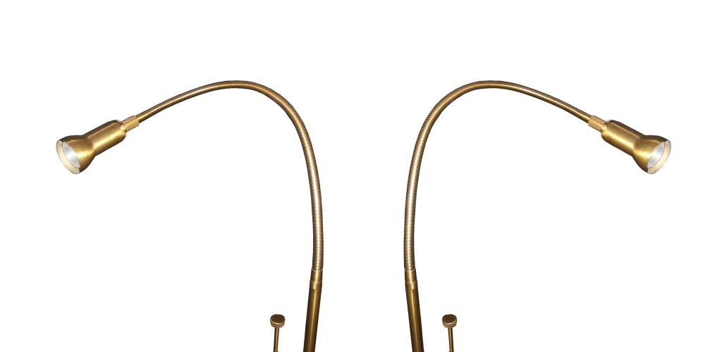 Beautiful pair or brass floor lamps with an adjustable goose-neck arm which allows you to direct the light to your desired spot.<br />
These bedside reading lamps feature a special lens that can adjust the spread and intensity of the beam of light.