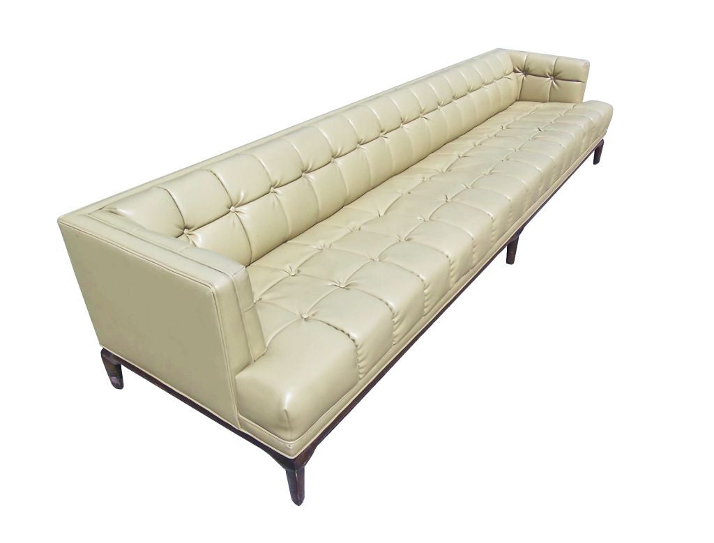 A magnificent 10ft sofa in tufted Naugahyde designed by Maurice Bailey for Monteverdi-Young custom-made for Dr Julius Griffin in the early 1960s.
This beautiful sofa has everything going for it, it is elegant it has great architectural lines is