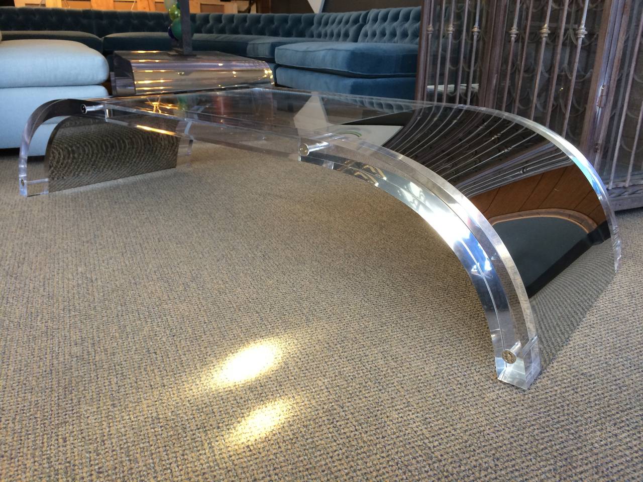 This piece is in stock and ready to ship.

Beautiful waterfall coffee table designed and manufactured by Charles Hollis Jones (circa 1960s) model CHJ-494.
The table is executed in Lucite and stainless steel inlay, the Lucite is 2