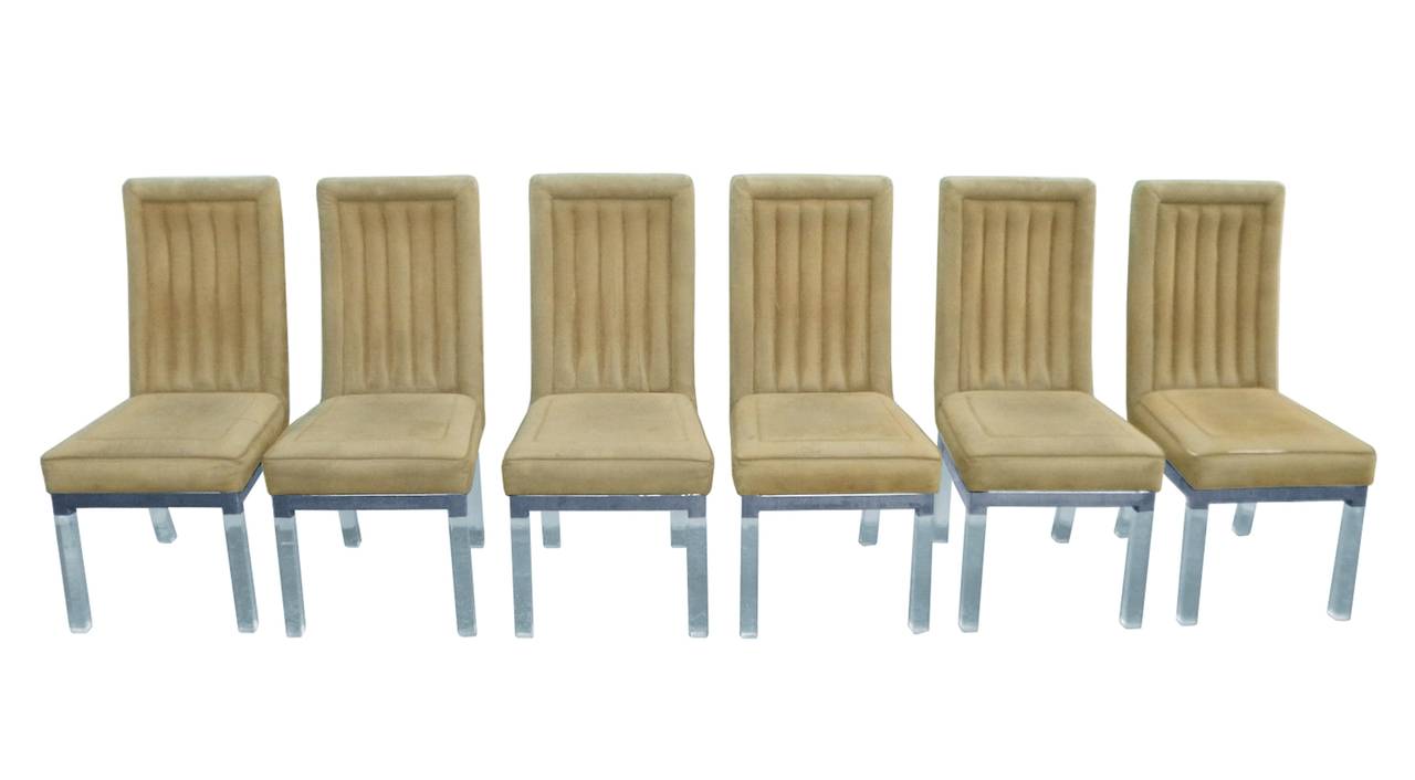 Beautiful set of six dining chairs in Lucite and nickel with high backs designed and manufactured by Charles Hollis Jones.
The chairs are upholstered in a taupe microfiber fabric which is in fair to poor condition and they must be