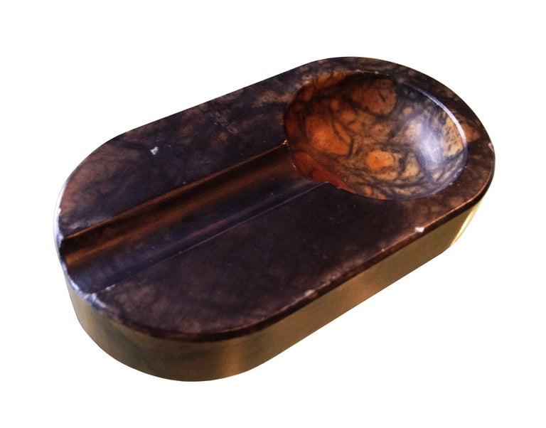 Stunningly beautiful vintage cigar tray made of solid Alabaster and manufactured in Italy.
The piece is nicely polished and only with some minor surface nicks due to use and age.
The piece is 1 1/4