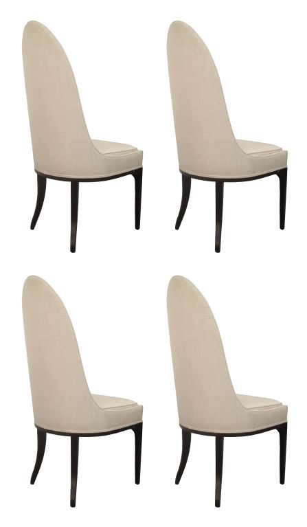Stunning set of four spoon-back chairs designed by Harvey Probber in the 1950's.<br />
These chairs have wonderful architectural lines, the backrest is very unique and different from most chairs, the base is ebonized walnut wood and is very nice