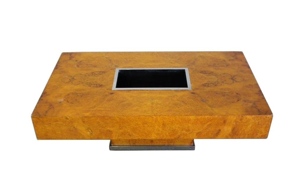 Stunning burl-wood Art Deco coffee table  featuring a metal insert to use as a planter.
The table has a chrome base which is very sturdy and substantial and it will be refinished prior to delivery.
Dimensions: 27.5