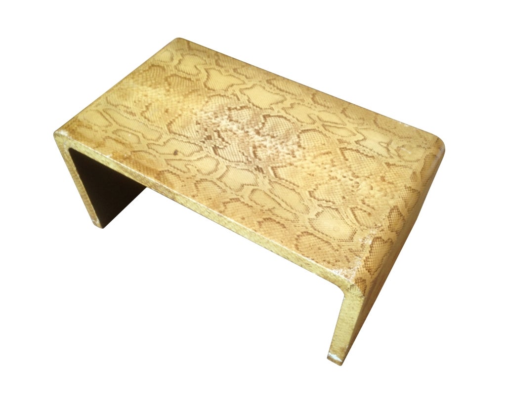 Vintage coffee table in the style of Karl Springer.
The table is upholstered in a genuine snake skin, the table is in vintage condition and it does show signs of wear and the leather/skin has some gashes in a few areas however there are no