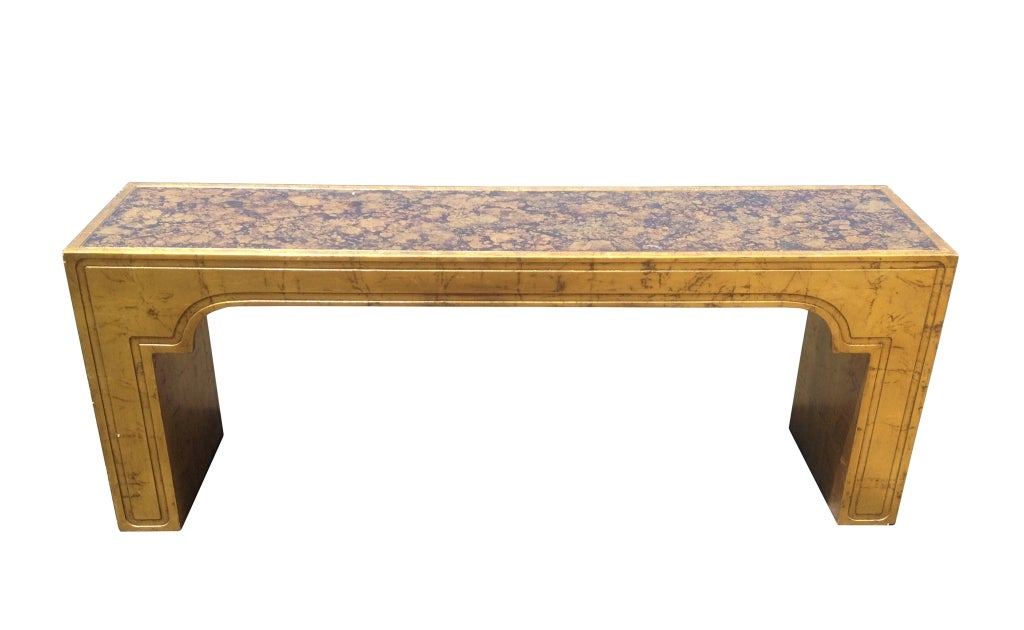Stunningly beautiful console table by the designer of the stars Phyllis Morris of Beverly Hills.
The table is solidly built and embossed in gold leaf with an oil drop design on the top.
The table is finished all around so it can be used anywhere,