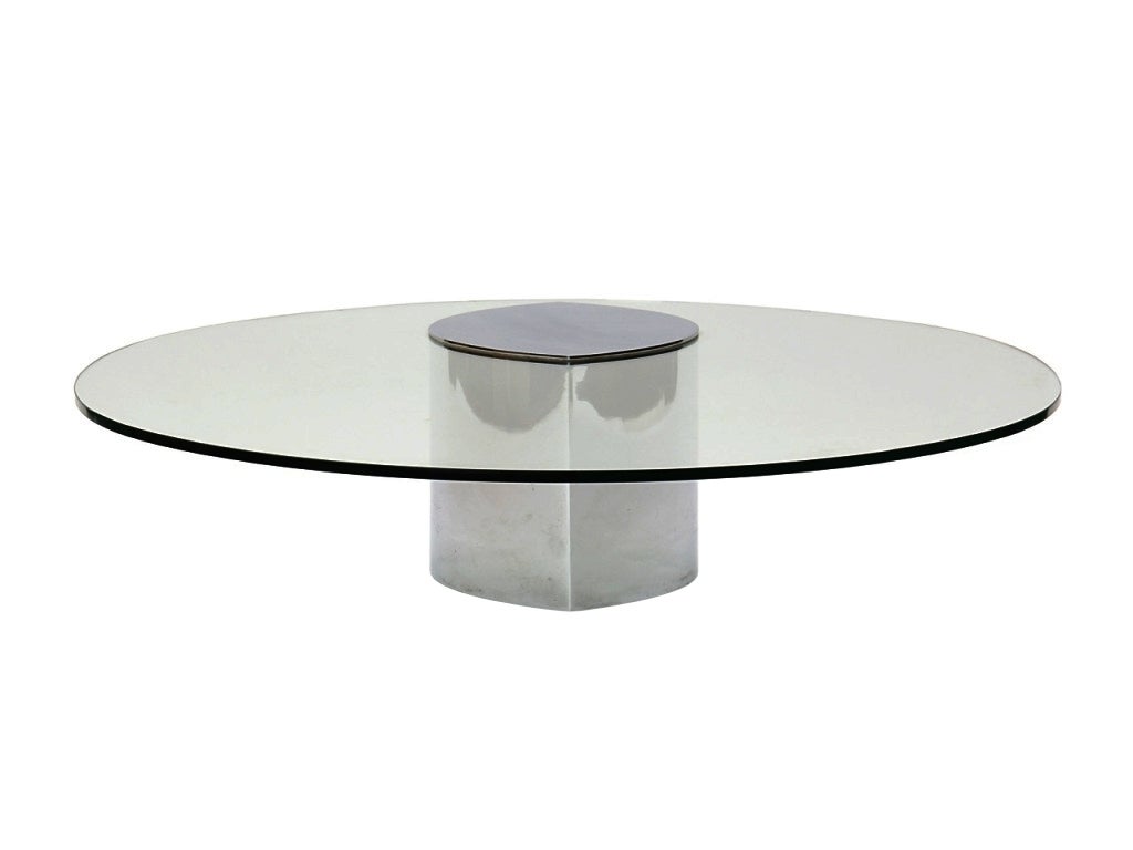 Originally designed in the 70's the Lunario table is a truly unique cantilevered table.
The table top is a clear polished oval tempered plate glass with polished steel inset cap which sits upon the sheet steel, polished chrome base. Weights within