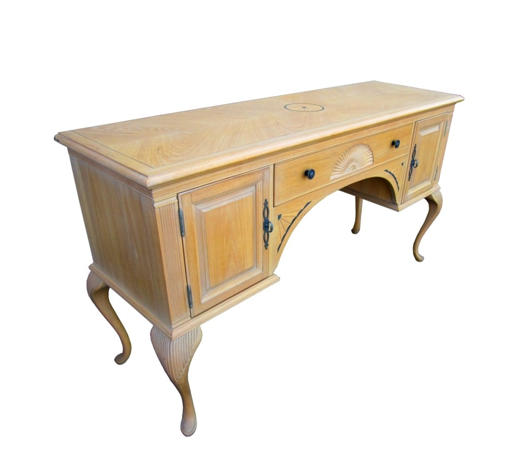 A very nice blond buffet by Bernhardt furniture. This piece is absolutely beautiful, very sturdy and well designed. The buffet features two cabinets with shelves for storage and one drawer for silverware.

The piece is labeled and it retains the