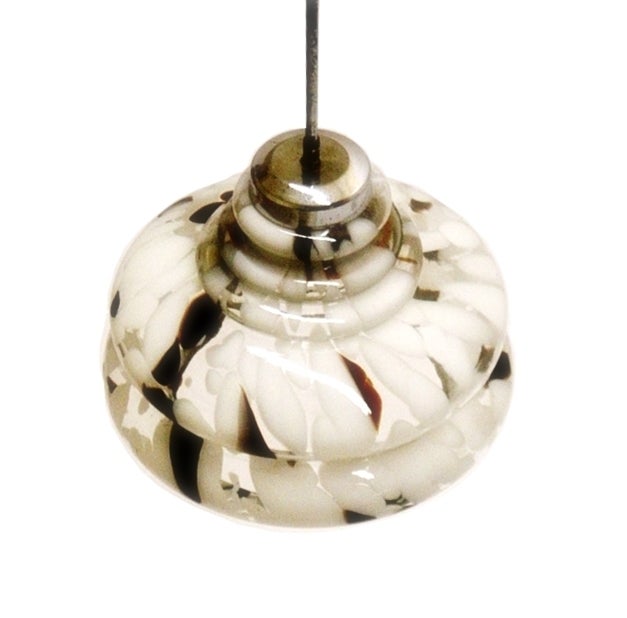 1950’s Hand-Blown Murano Glass Chandelier (Black & White)

This wonderful  Italian chandelier is in excellent condition with no chips or cracks, it has a chrome trim on the edges and a metal rod at attach to the ceiling.

The chrome around the