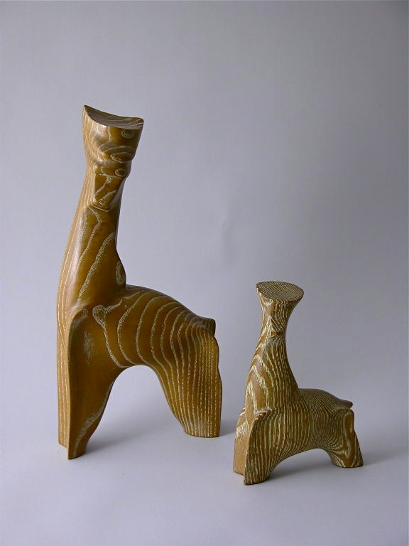 A pair of animal sculptures described elegantly in plainer form.
