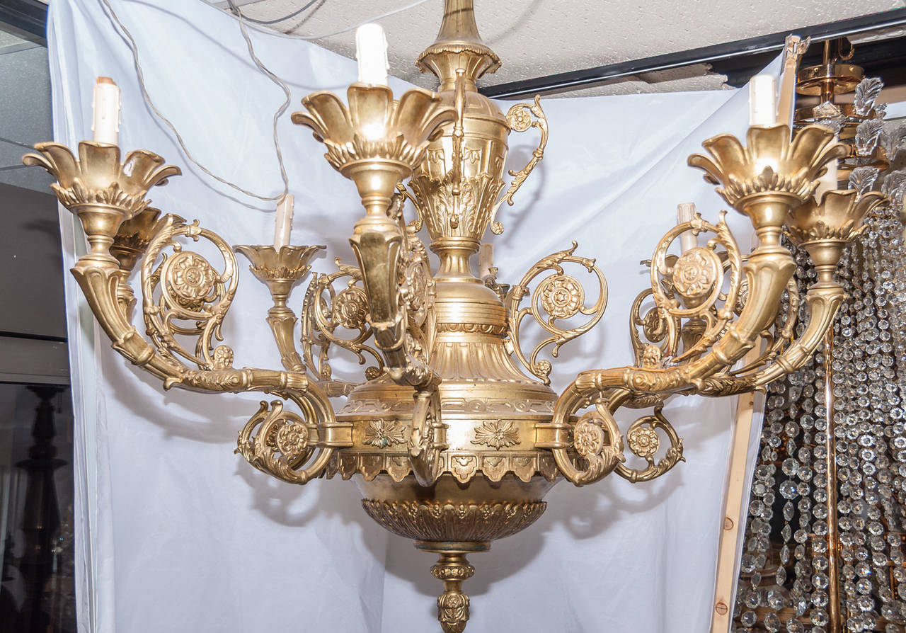 A very large French Louis XVI style bronze eight-light chandelier, circa 1920. Stock number: L174.