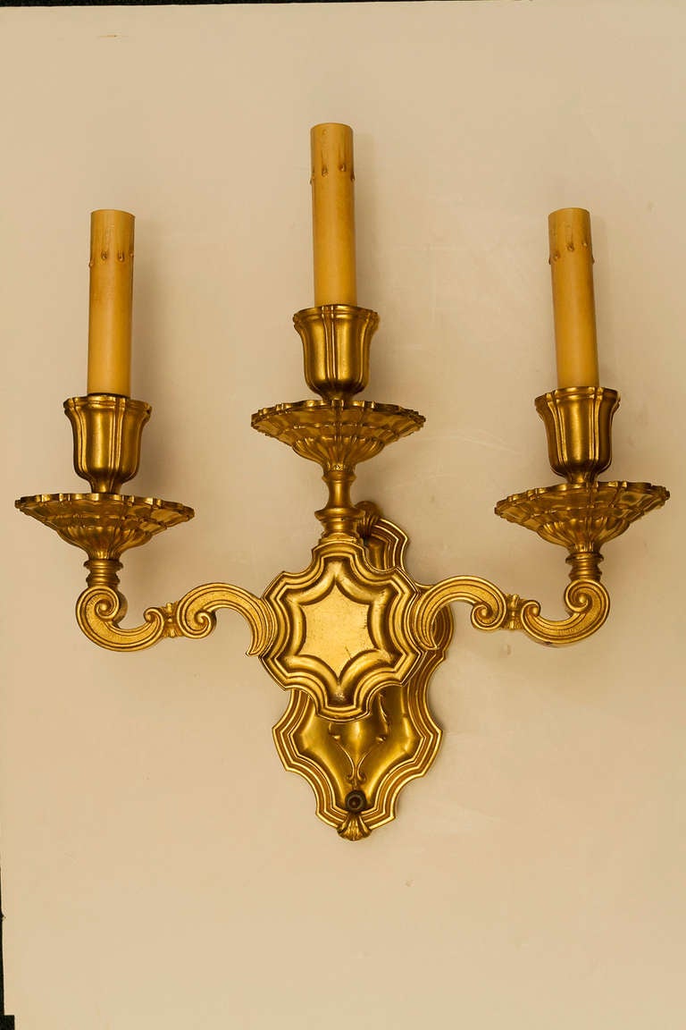 Pair of Caldwell Gilt Metal Three-Light Sconces For Sale 1