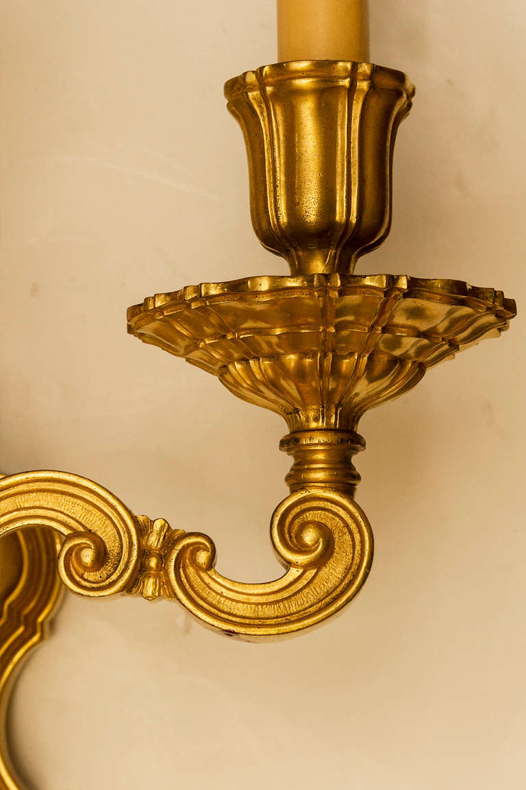 Pair of Caldwell Gilt Metal Three-Light Sconces In Good Condition For Sale In New York, NY