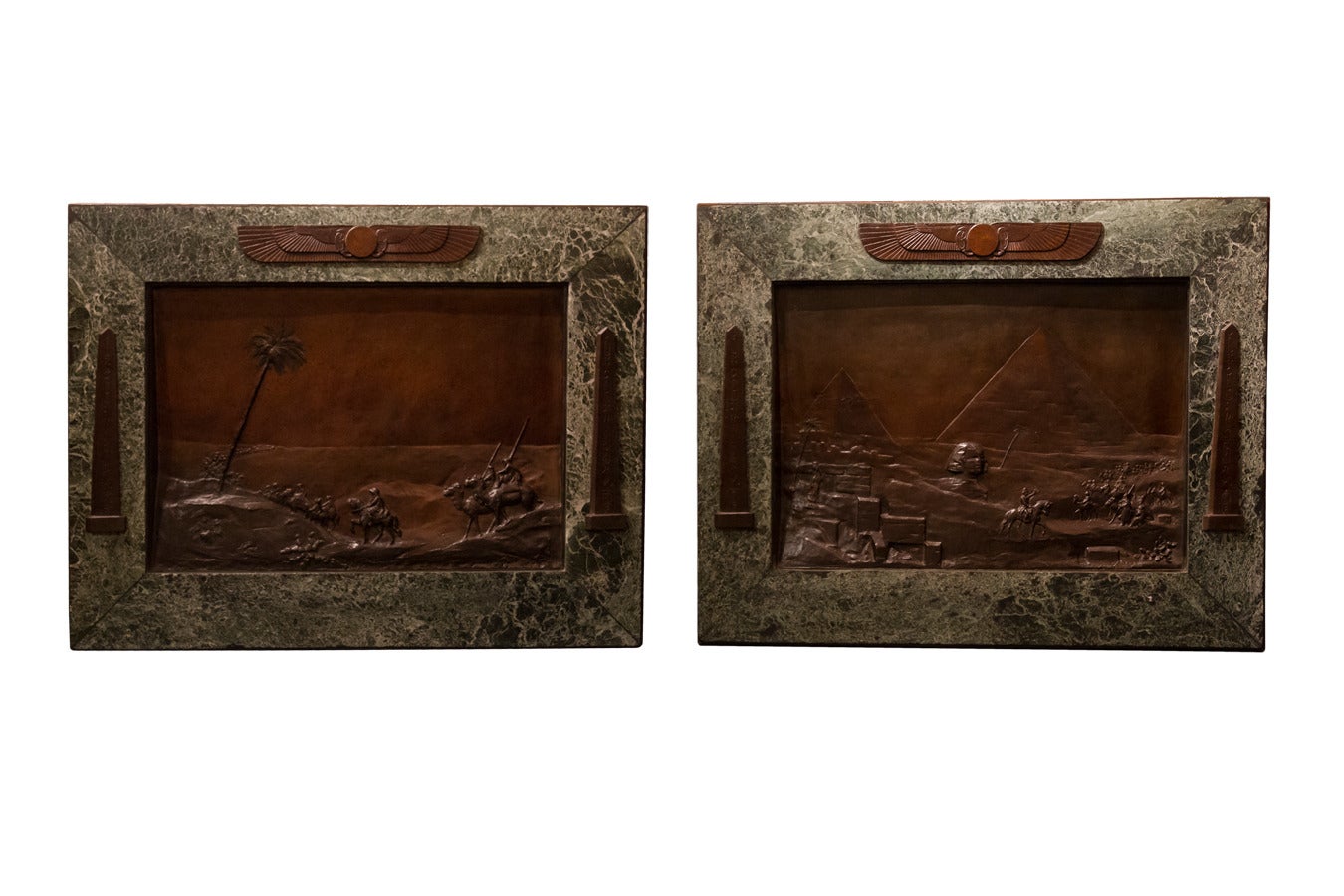 Pair of Patinated Metal Egyptian Revival Palques in Marble Frame