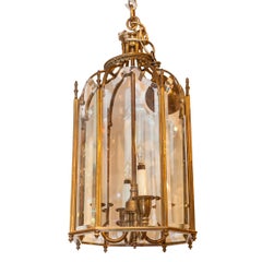 One Hexagonal Bronze and Glass Four-Light Lantern