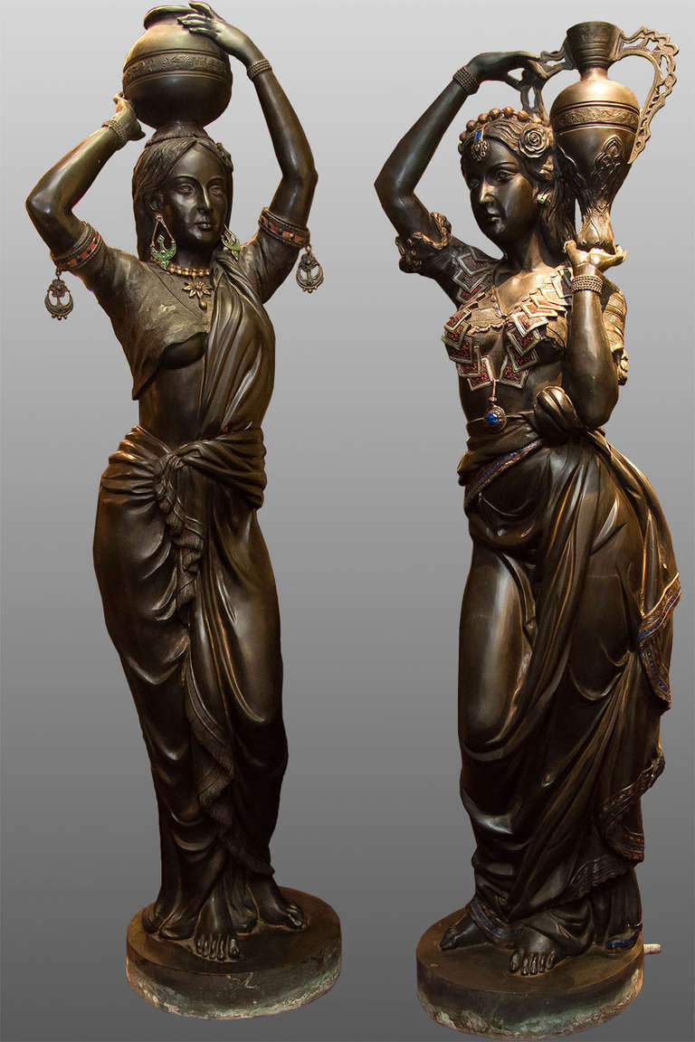 Pair of lifesize polychrome patinated Orientalist bronze figures of young beauties after model in the style of Charles Cordier, made for gasolier.
