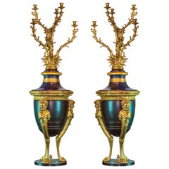 Pair of French Louis XVI Style Patinated and Gilt Bronze Figural Torcheres