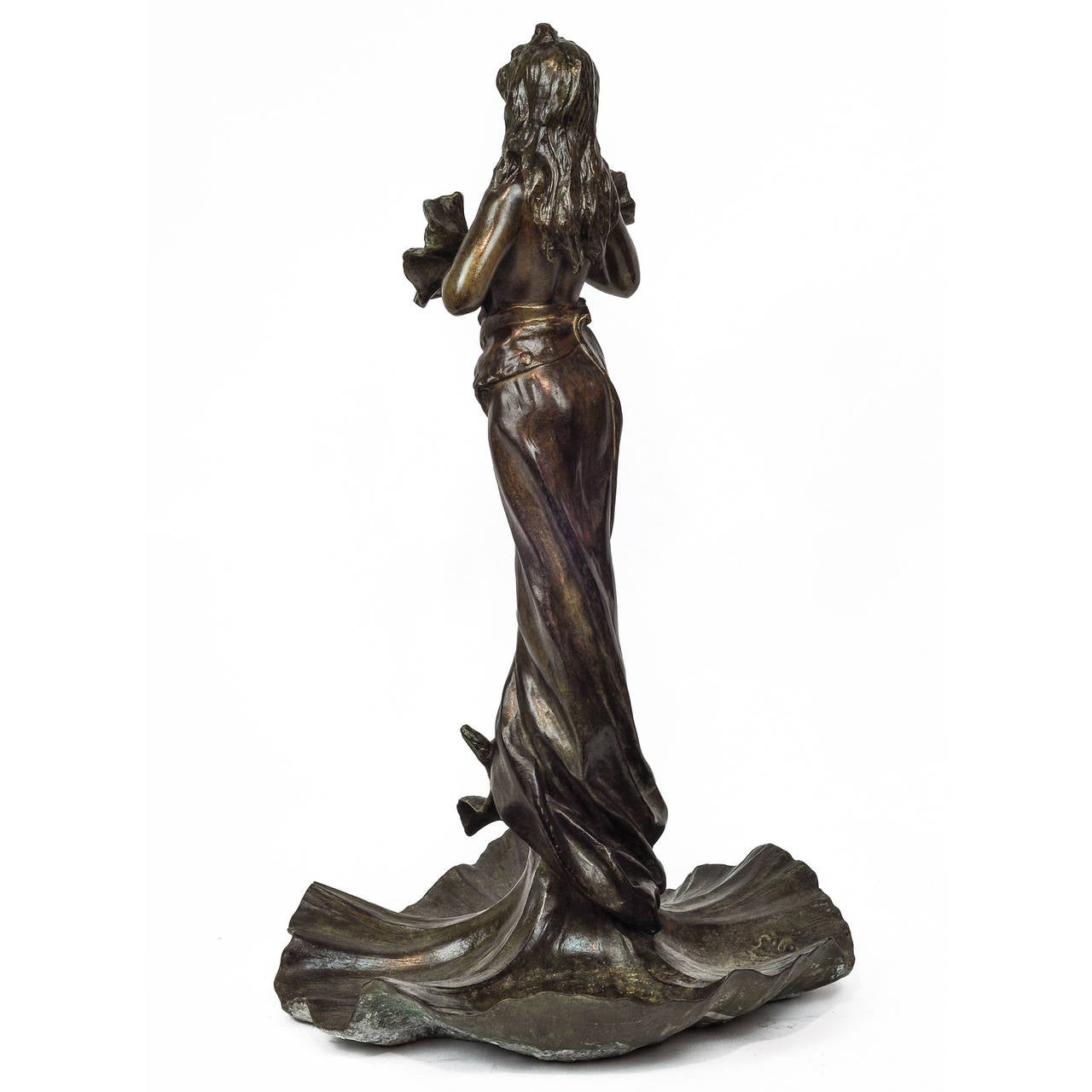 Patinated bronze sculpture of a young girl standing barefoot on top of a hibiscus. Her dress has three hibiscus on her breast and her gown drapes downward forming a large hibiscus at the bottom.  Signed:  E. Villanis.
Stock Number: SC60