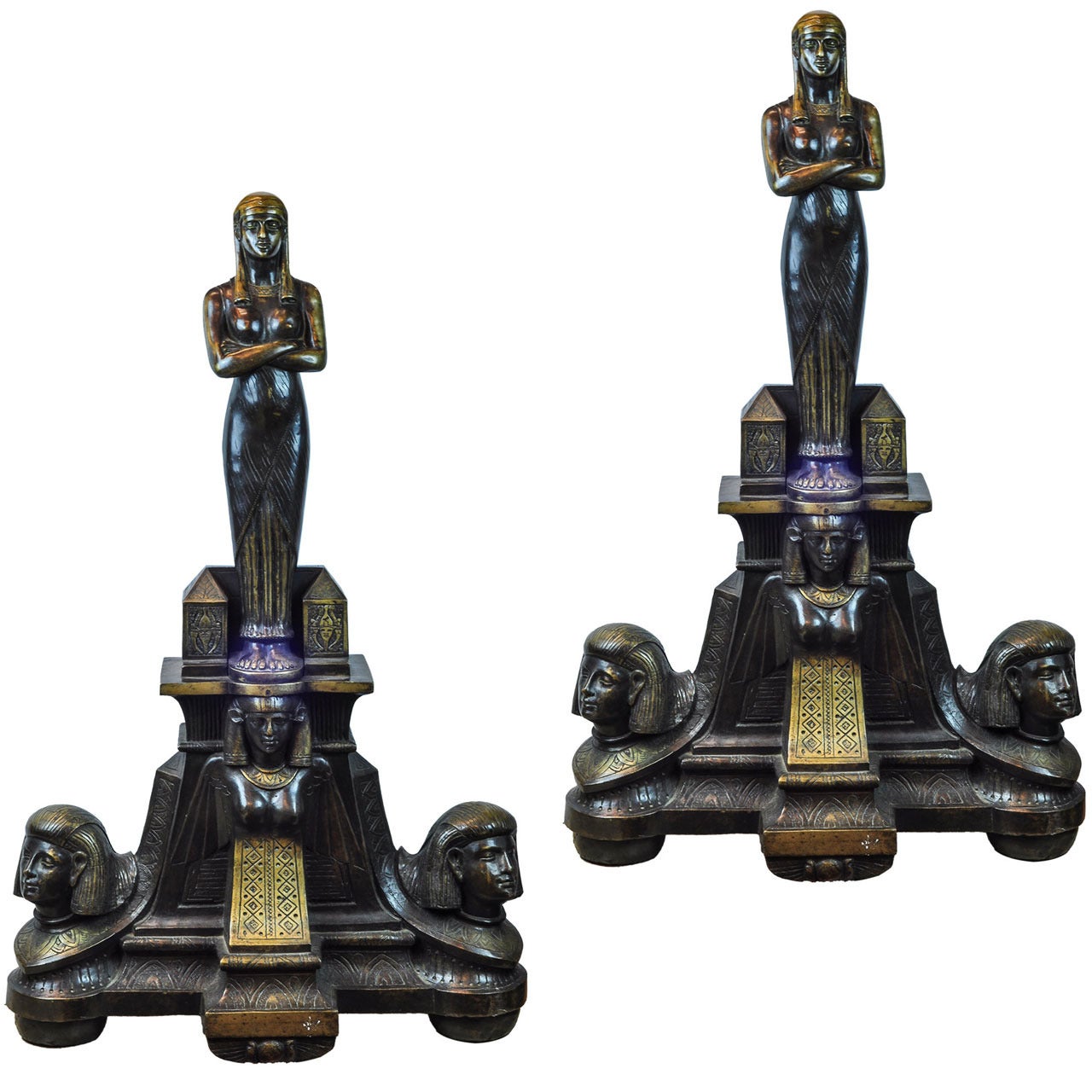 Pair of Egyptian Revival Patinated and Gilt Bronze Figural Andirons