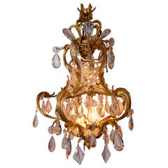 French Louis XV Style Crystal and Bronze Cage Form Chandelier with Crown Top