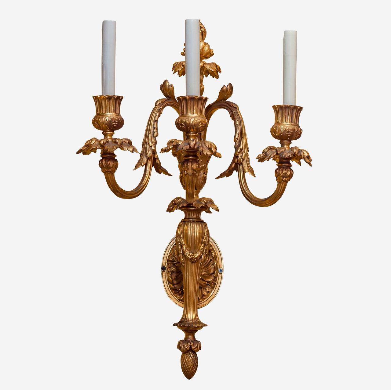 Exquisite set of four gilt bronze three-arm Louis XVI style wall lights.
Stock number: L208.
