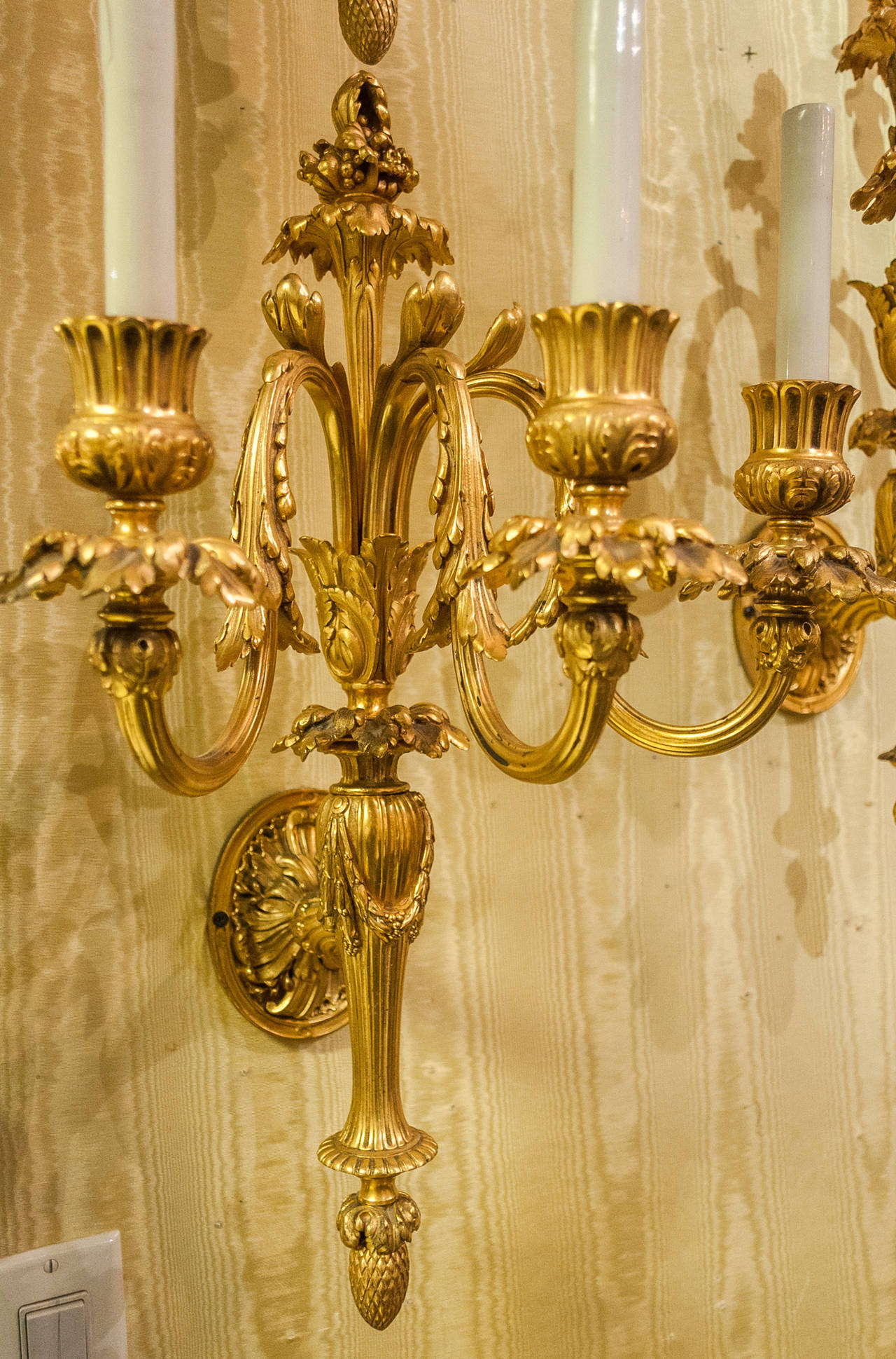Exquisite Set of Four Gilt Bronze Three-Arm Louis XVI Style Wall Lights 1
