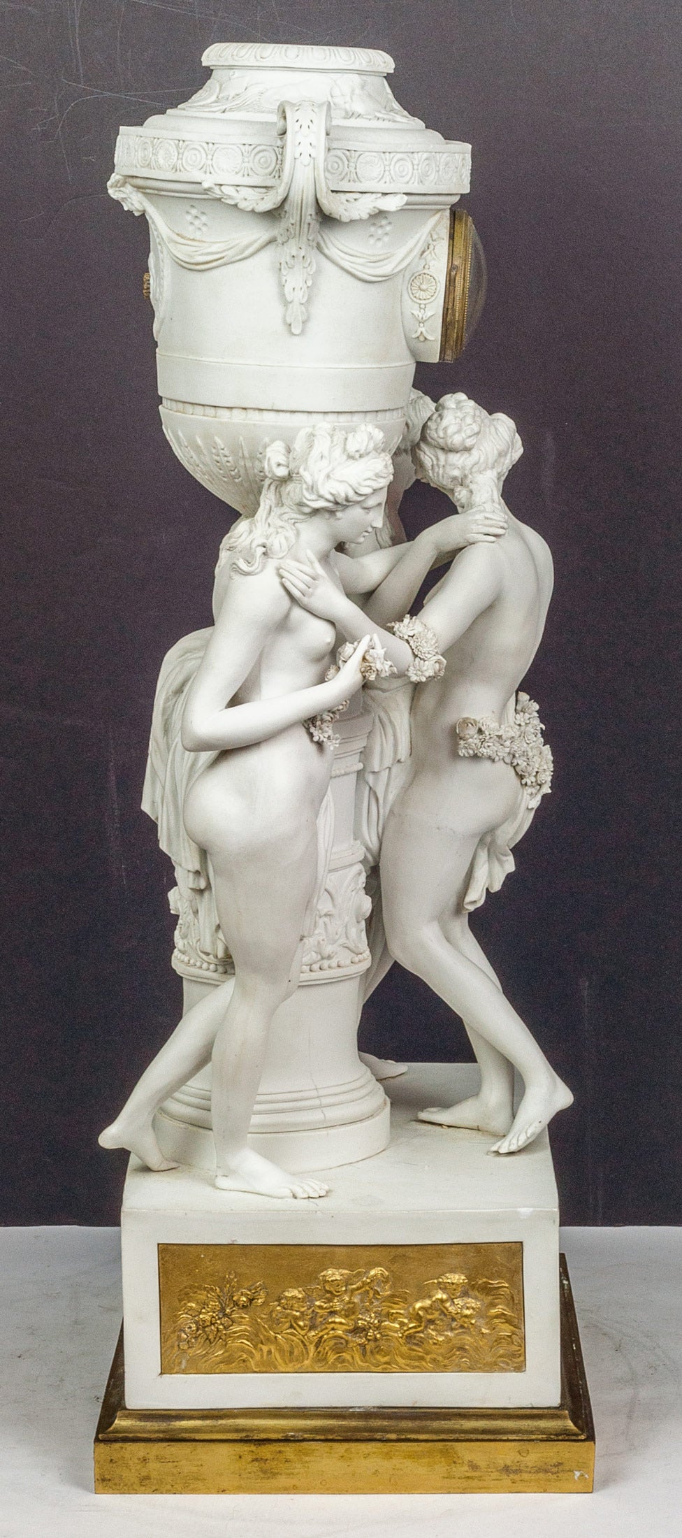 A Neoclassical French Bisque Porcelain Figural Mantel Clock with Standing Nude Figures on Bronze Base.
Stock Number: CC22