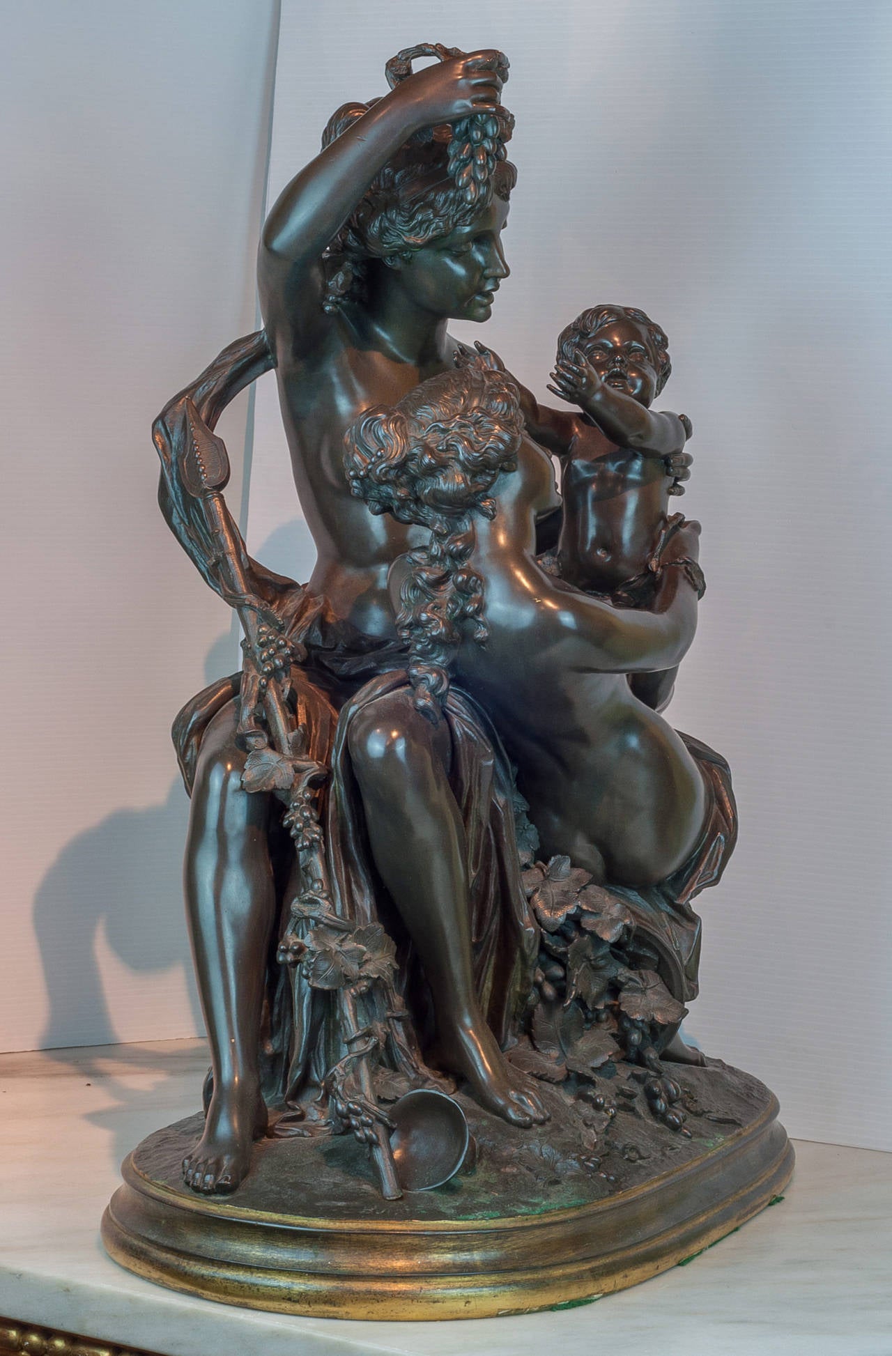 Large Patinated and Gilt Bronze Figural Group of Maidens with a Cherub