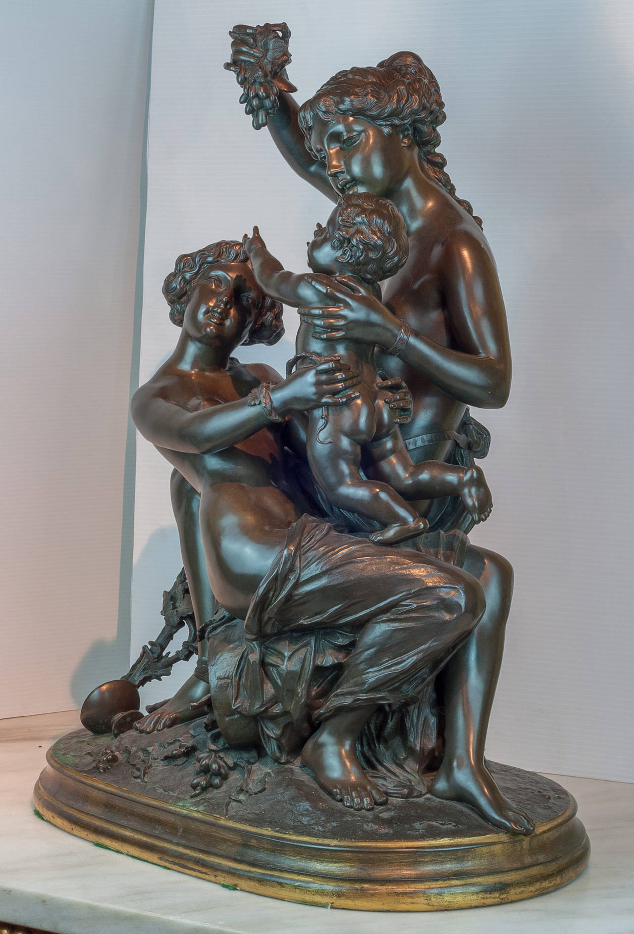 Large Patinated and Gilt Bronze Figural Group of Maidens with a Cherub In Good Condition In New York, NY