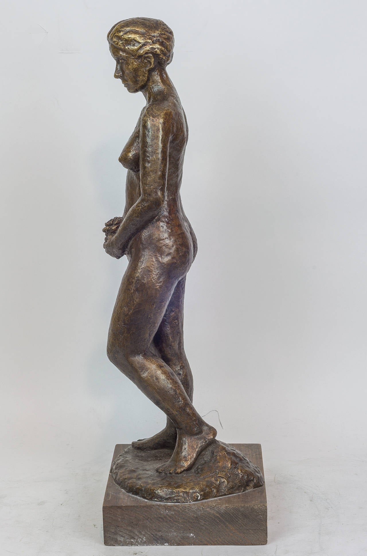 Patinated Bronze Figure of a Standing Nude Holding Flowers In Excellent Condition In New York, NY