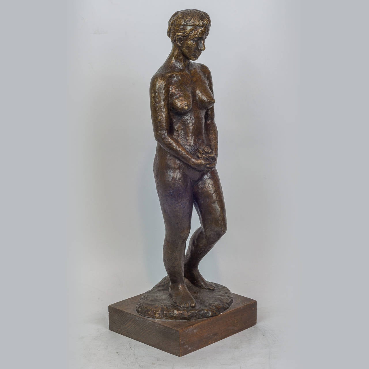 Agra Patinated Bronze Figure of a Standing Nude Holding Flowers