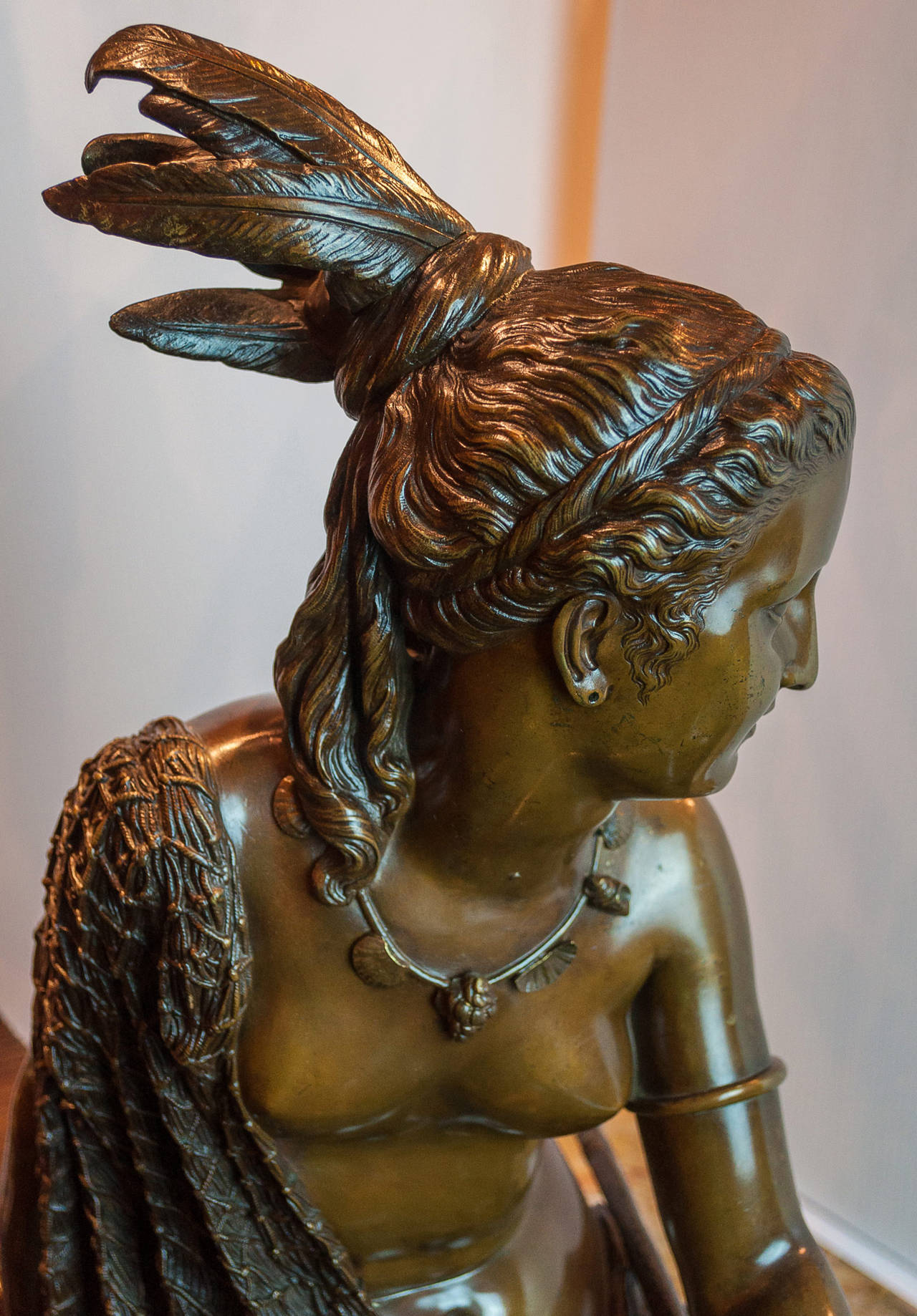 A Large Bronze Sculpture of a Beautiful Native American Indian Maiden sitting in a Canoe on a marble pedestal base.
Signed: Duchoiselle
Stock Number: SC78