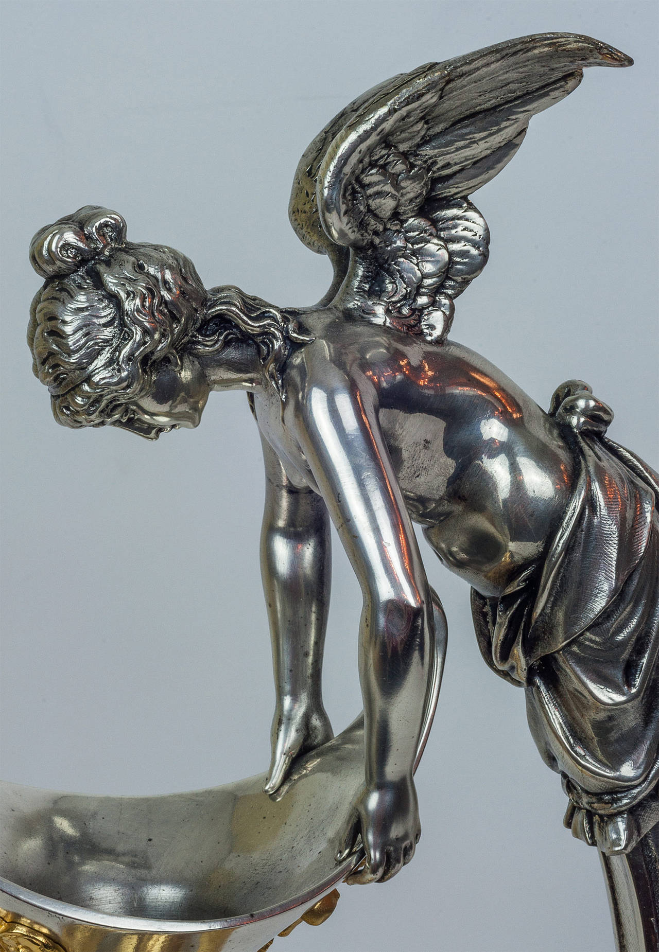 Each having a single handle accented with Classical style winged nymphs, above the spout having a figural mask mount, and rising on a pedestal base terminating on paw feet.
Signed
Stock Number: DA54