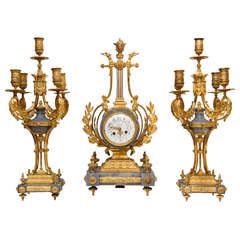 A  Louis XVI style gilt  Bronze and  Bleu Turqin marble clock set