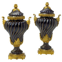 Pair of French Gilt Bronze Mounted Sevres Style Porcelain Covered Urns