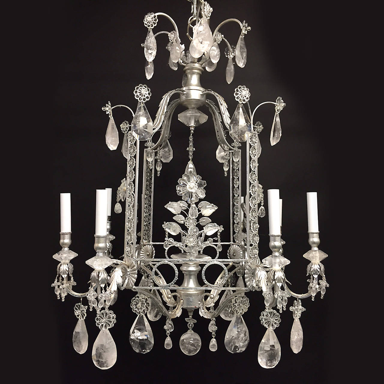 Magnificent pair of rock crystal and gilt metal silvered cage form eight-light chandeliers.
Stock number: L369.
