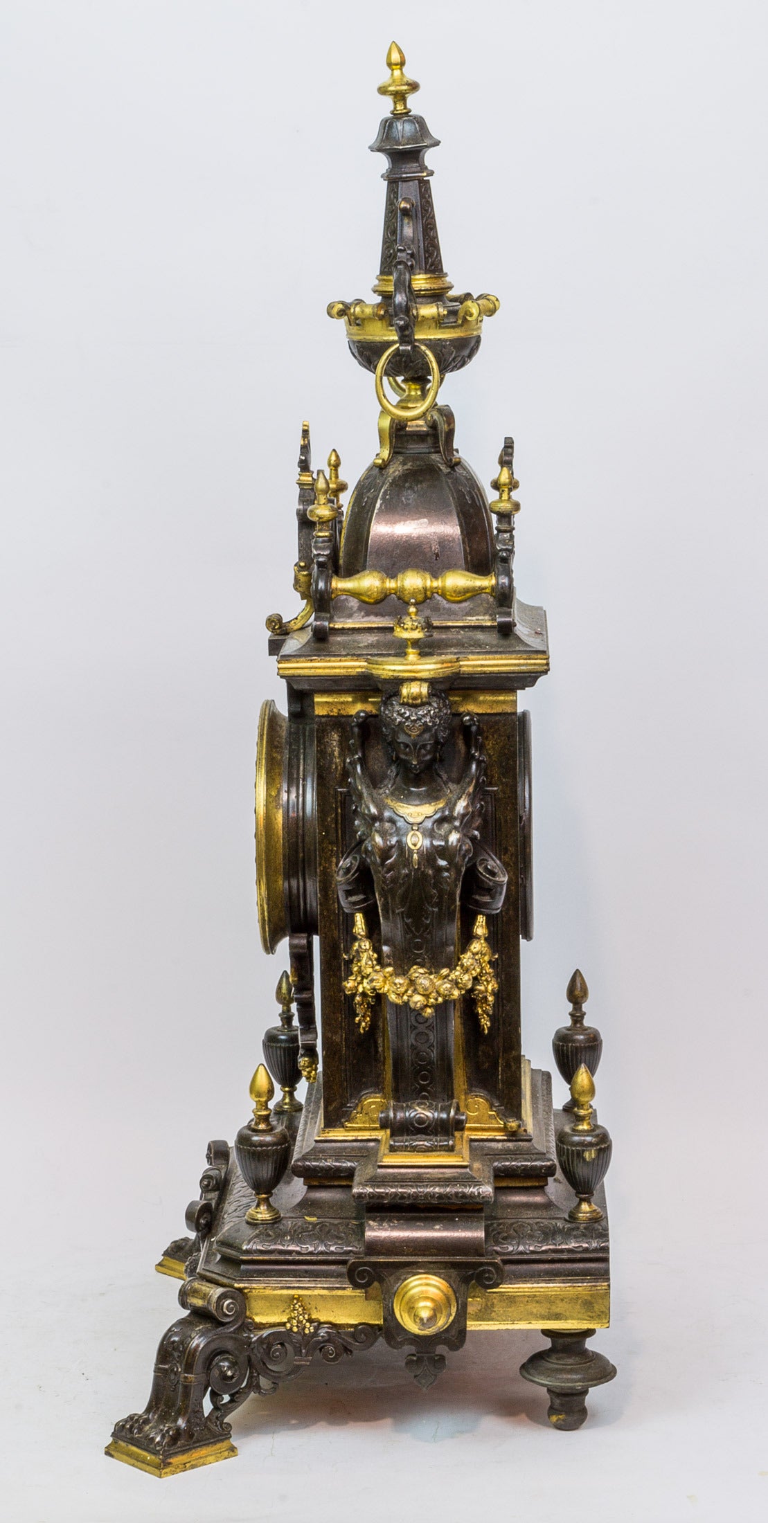 An Important Gilt and Patinated Bronze Figural Renaissance Style Mantel Clock, with figures on either side in the Louis XVI style
Stock Number: CC23