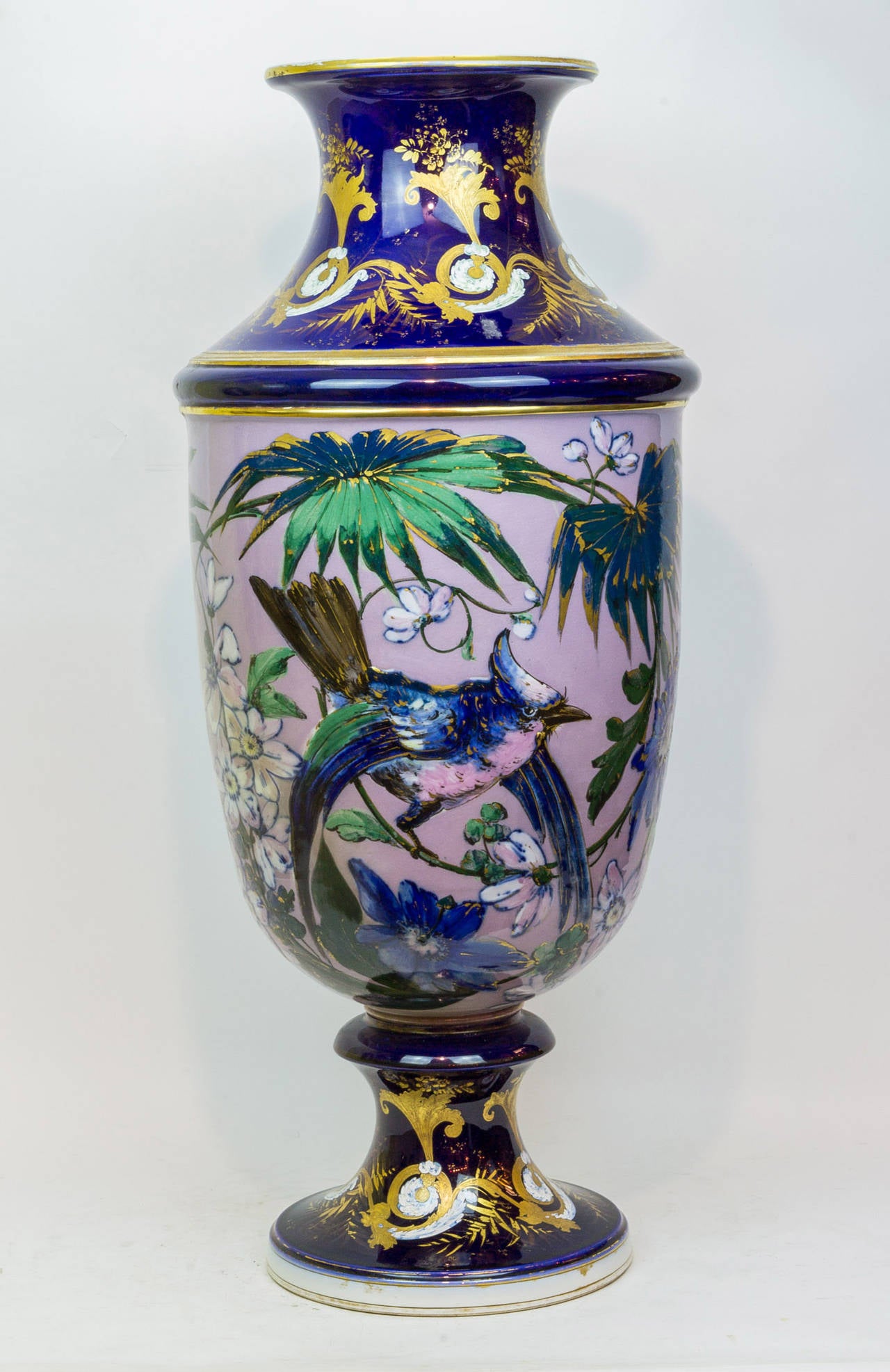 A large and unusual Aesthetic Movement porcelain vase with hand-painted floral and bird decorations.
Stock number: PP31.