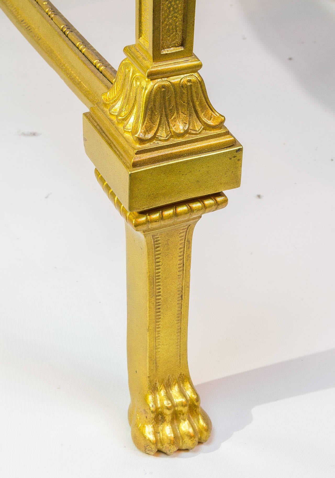 An Egyptian Revival gilt bronze figural two-tier marble and glass table with seated Egyptian figures.
Stock number: F42.