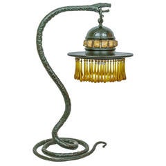 Antique Tiffany Style Patinated Metal Lamp with Snake Form Base and Amber Glass Drops