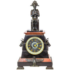 Egyptian Revival Patinated Bronze and Rouge Marble Figural Mantel Clock